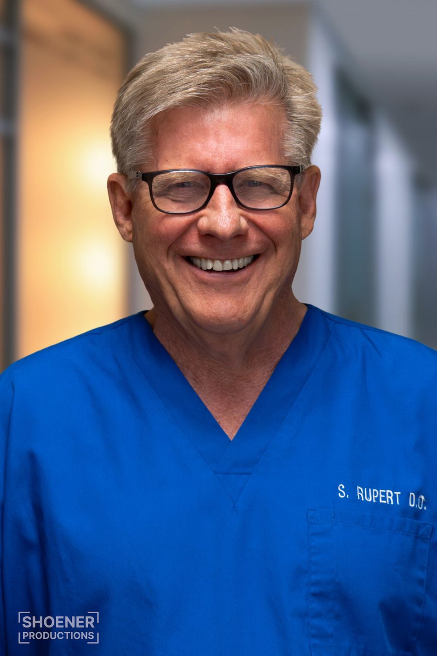 Portrait of a doctor in blue scrubs